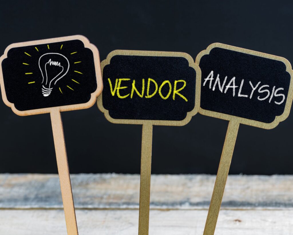 small wooden signs that say vendor analysis