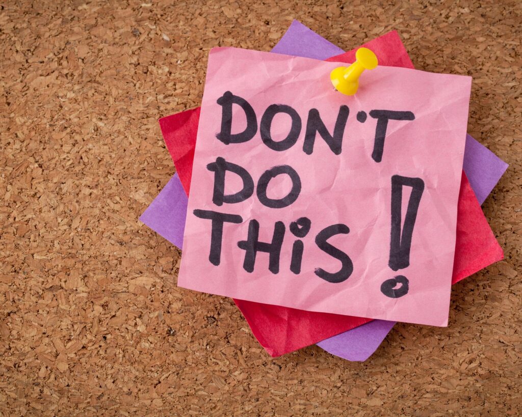Corkboard with a note on it that says "Don't do this!"